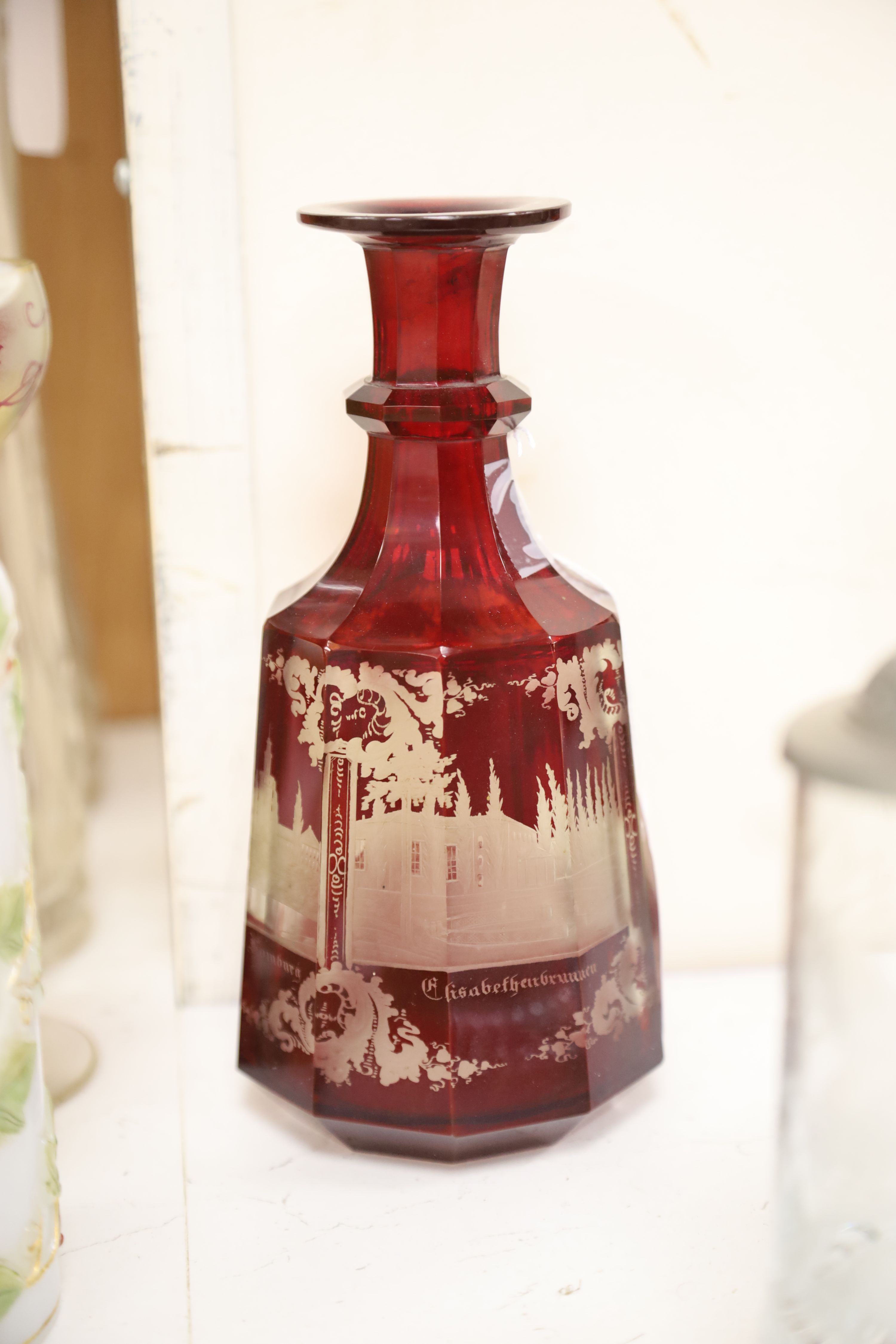 A collection of mixed glassware, including a Bohemian ruby flash decanter